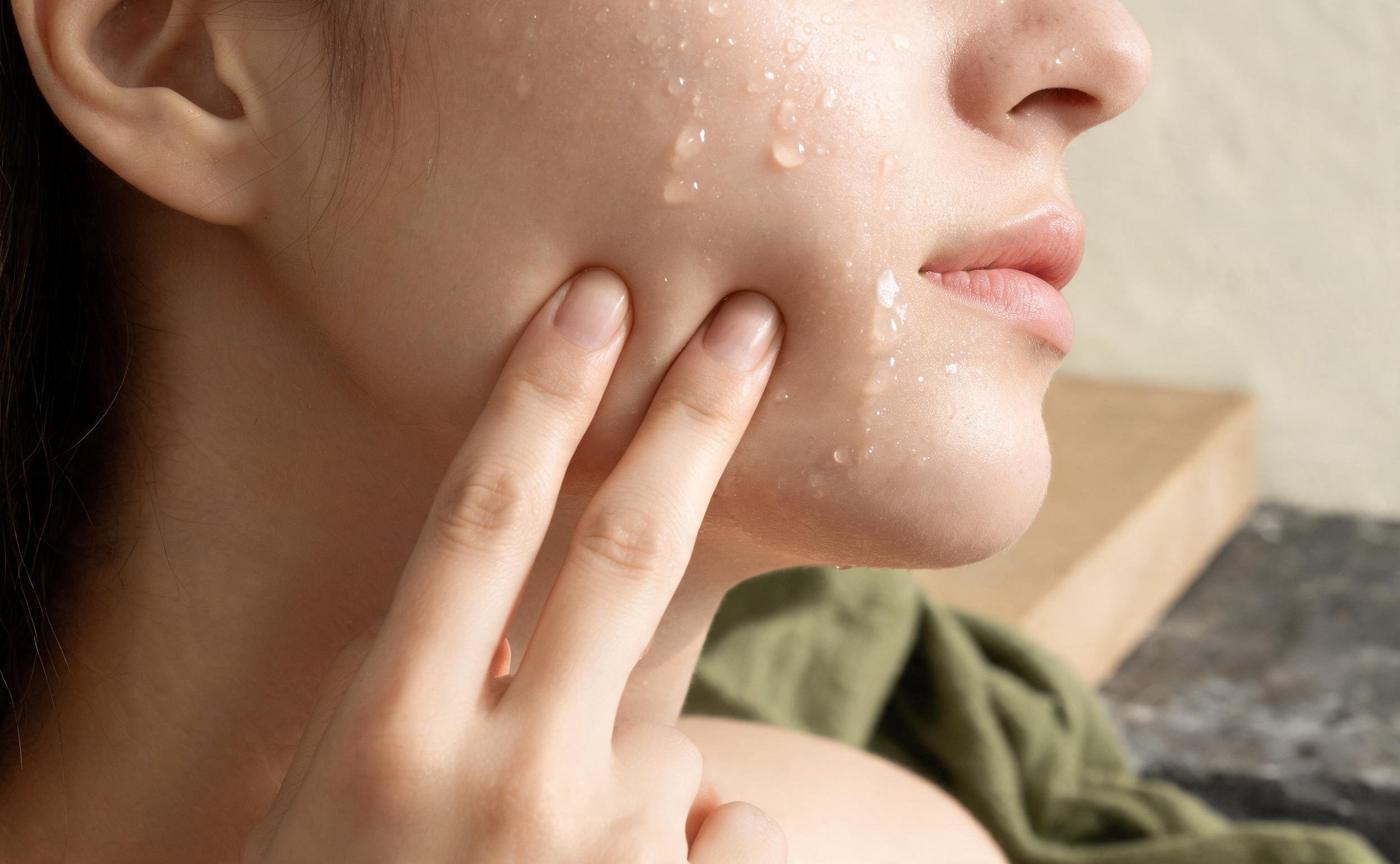 Hydration direction: dewy cheek with water droplets
