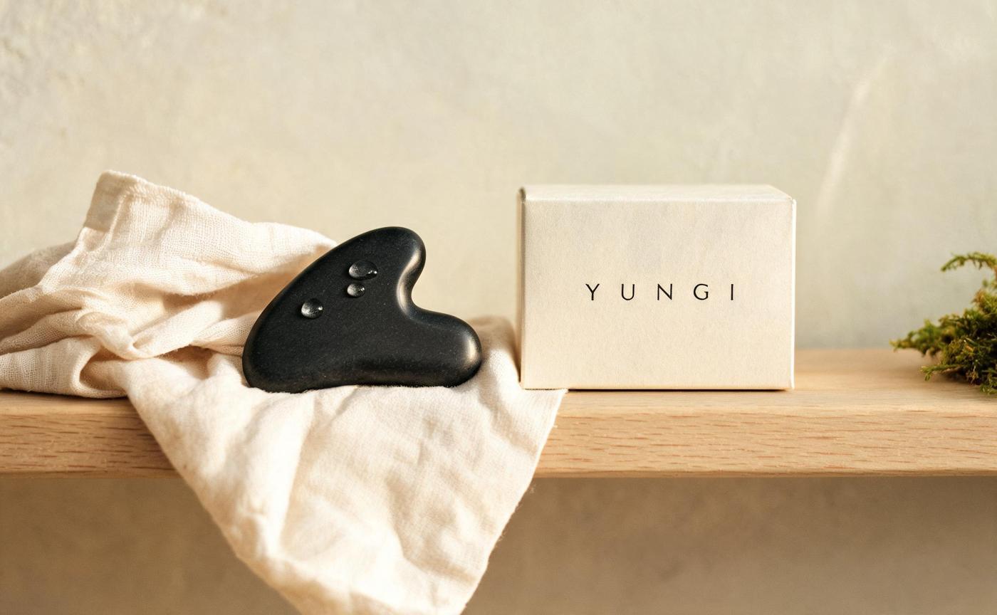 Basalt gua sha stone on linen